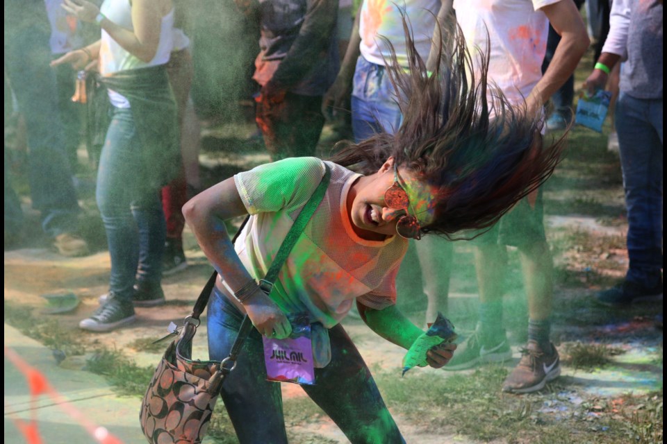 The Festival of Colours draws thousands of people out to throw their worries and troubles to the air. (file). 