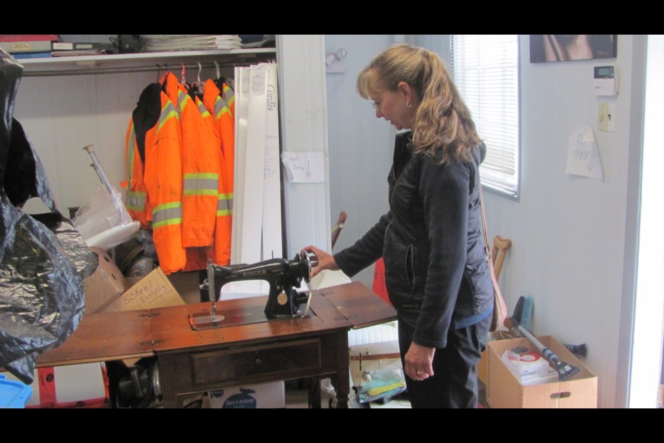 Thunder Bay's Irene Juvshik makes a last check on refurbished sewing machines (submitted photo)
