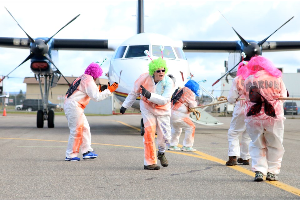 Brenda Beaulieu, captain of the Wingnuts, cheers on her team during the Third Annual Wasaya United Way Plane Pull on Saturday. (photos by Doug Diaczuk - Tbnewswatch.com). 