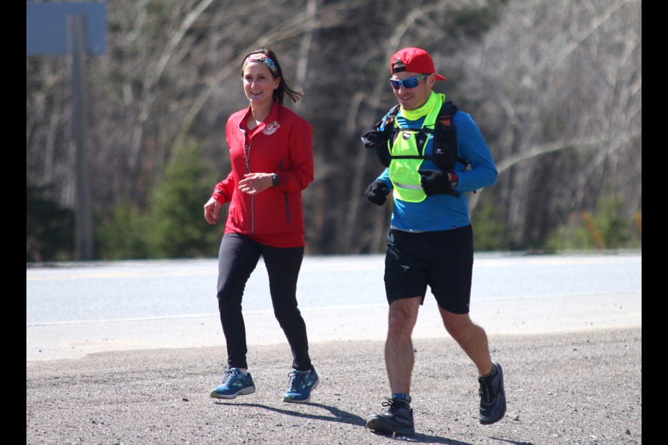 Antonio Stefanile ran 100 kilometres in support of youth running program, Thunder Bay Team Unbreakable. He was joined along the way by supporters, including runner Claudia Tropea. (Photo by Doug Diaczuk - Tbnewswatch.com). 