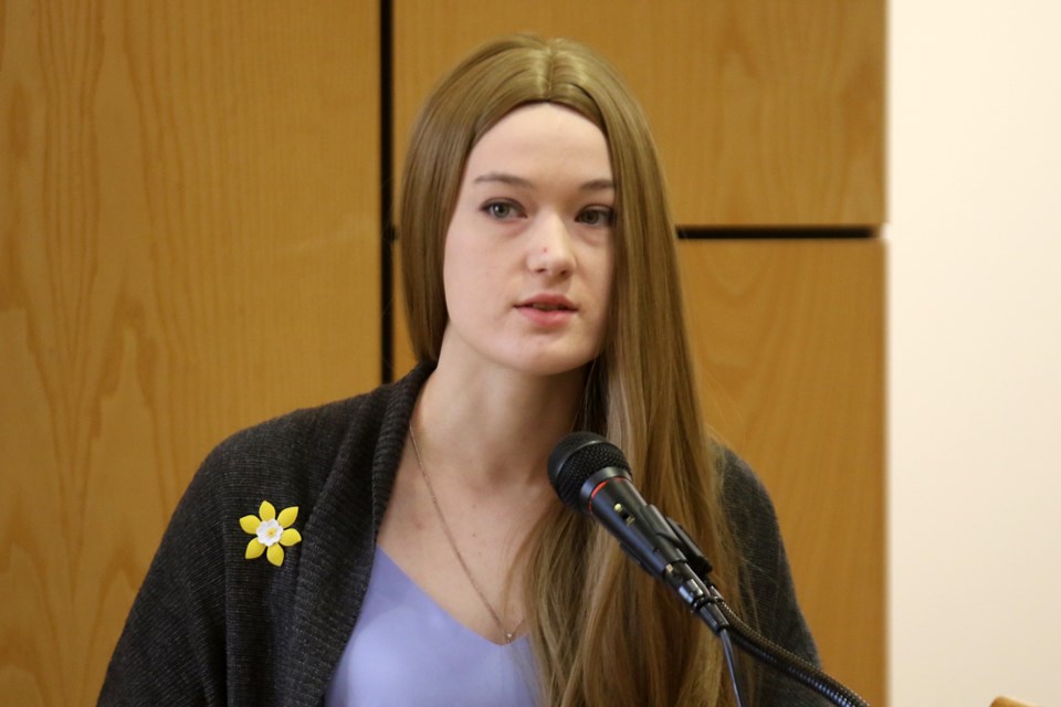 Cancer survivor Jeiyd Sedgwick on Monday, April 1, helps launch Daffodil Month at Thunder Bay city hall. (Leith Dunick, tbnewswatch.com)