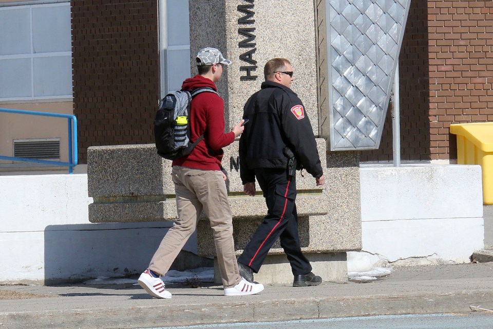 At least 11 marked and unmarked police vehicles swarmed Hammarskjold High School on Thursday, April 4, 2019 after a seventh threat was made against the Clarkson Street school. (Leith Dunick, tbnewswatch.com)