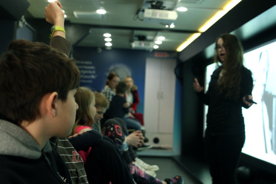 A group of Grade 3 students from St. Paul Elementary School  listen to Kingsbury's presentation on Tuesday. (Michael Charlebois, tbnewswatch)