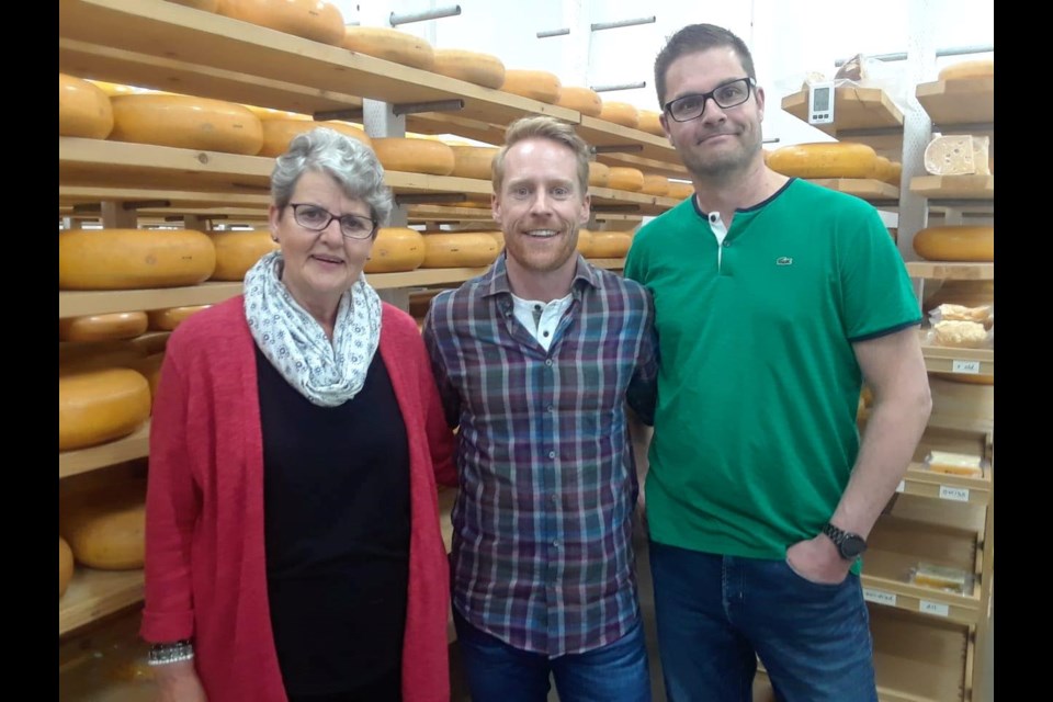 Margaret Schep, Amazing Race host Jon Montgomery, and Walter Schep from the Amazing Race Canada's visit in May. (Facebook / Thunder Oak Cheese Farm)