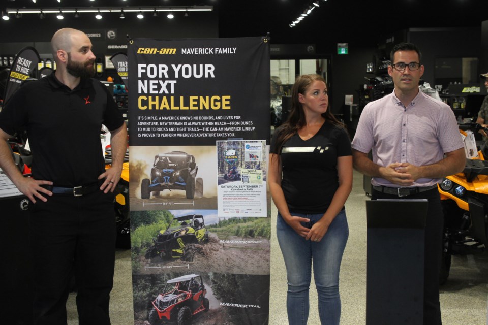 Daniel Trevisanutto (left), Sara Fisher, and Patrick Trevisanutto at a press conference for the 5 Aces ATV Fall Classic Poker Run at Half-way Motors Power Sports. (Michael Charlebois, tbnewswatch)