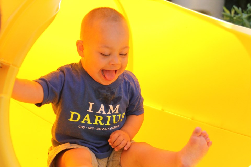 Darius Fitzgerald having fun in his brand new slide. (Photos by Michael Charlebois)