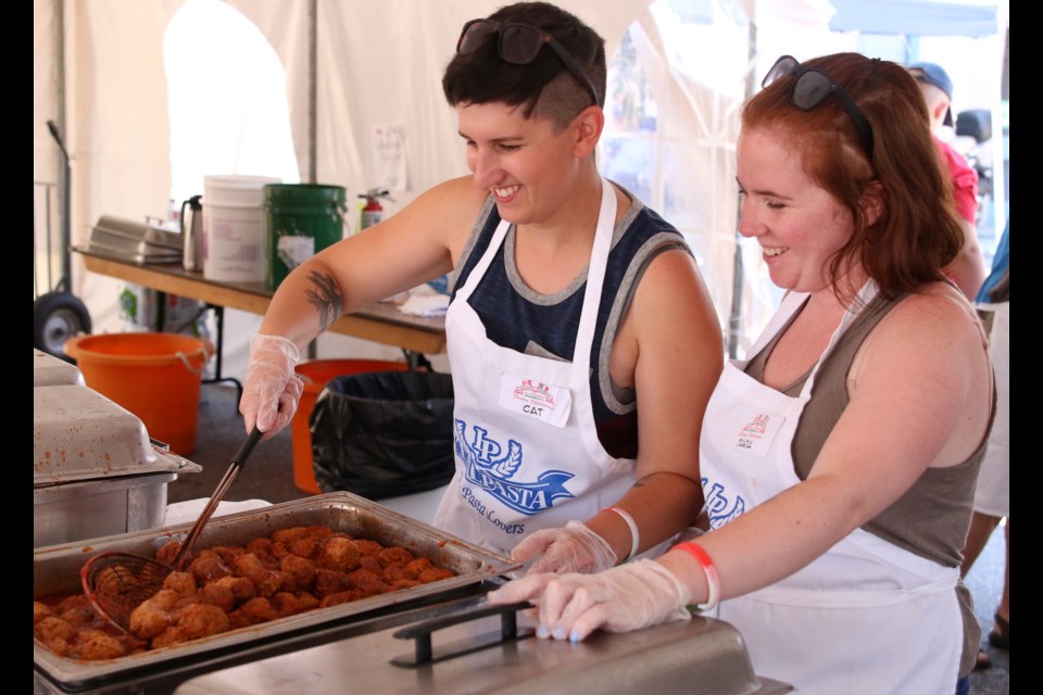Volunteers were busy serving up Italian dishes during the 29th annual Festa Italiana on Sunday. (Photos by Doug Diaczuk - Tbnewswatch.com). 