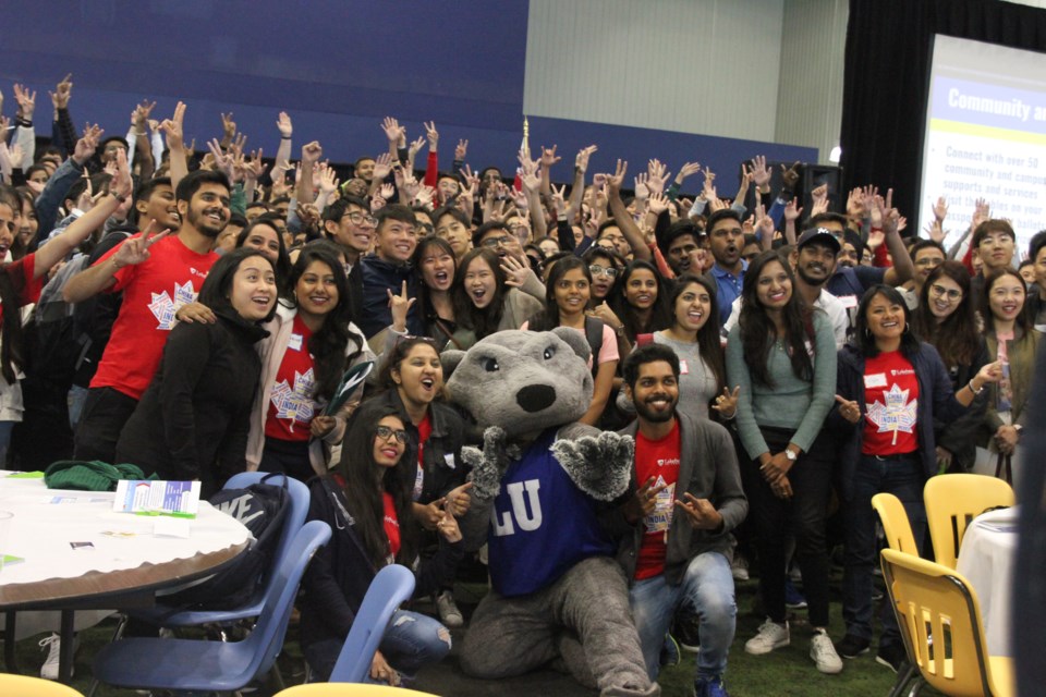 Wolfie and roughly 500 international students pose for a picture at LU international student orientation day. (Michael Charlebois, tbnewswatch)