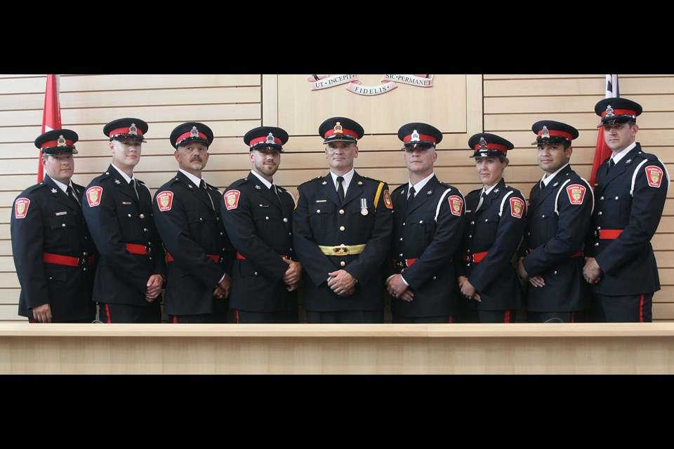 Thunder Bay Police Service deputy chief Ryan Hughes (centre) is joined by eight new constables who were sworn in on Monday, August 19, 2019. (Matt Vis, tbnewswatch.com)