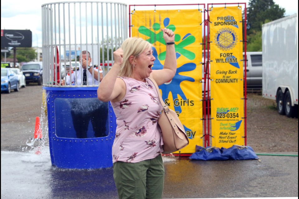 Jennifer Hughes cannot contain her excitement after successfully dunking her husband, Thunder Bay Police Service deputy chief, Ryan Hughes. (Photos by Doug Diaczuk - Tbnewswatch.com). 