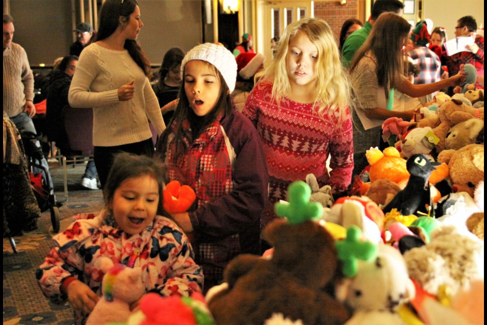 Children select stuffed animals at the annual Salvation Army Christmas dinner. (Photos by Ian Kaufman, Tbnewswatch.com)