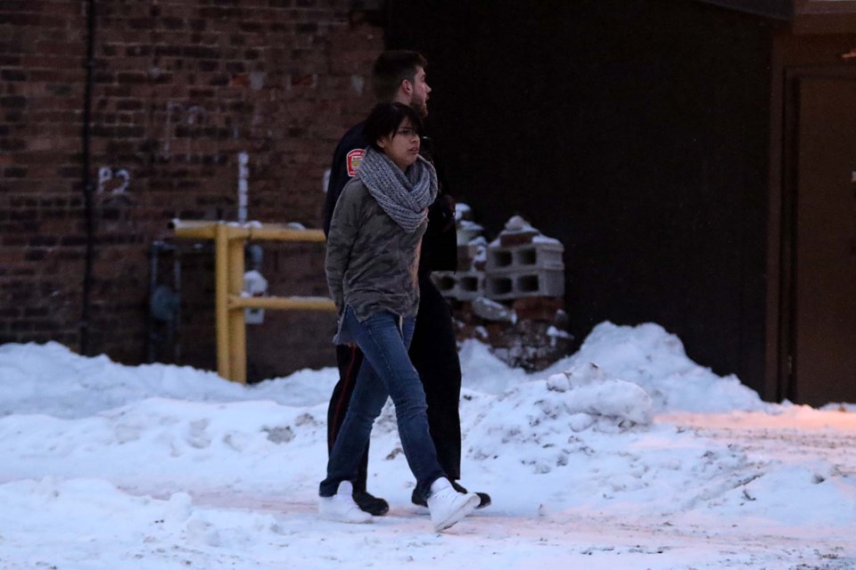 Police take a person into custody on Violet Street on Saturday, Dec. 14, 2019. (Leith Dunick, tbnewswatch.com)