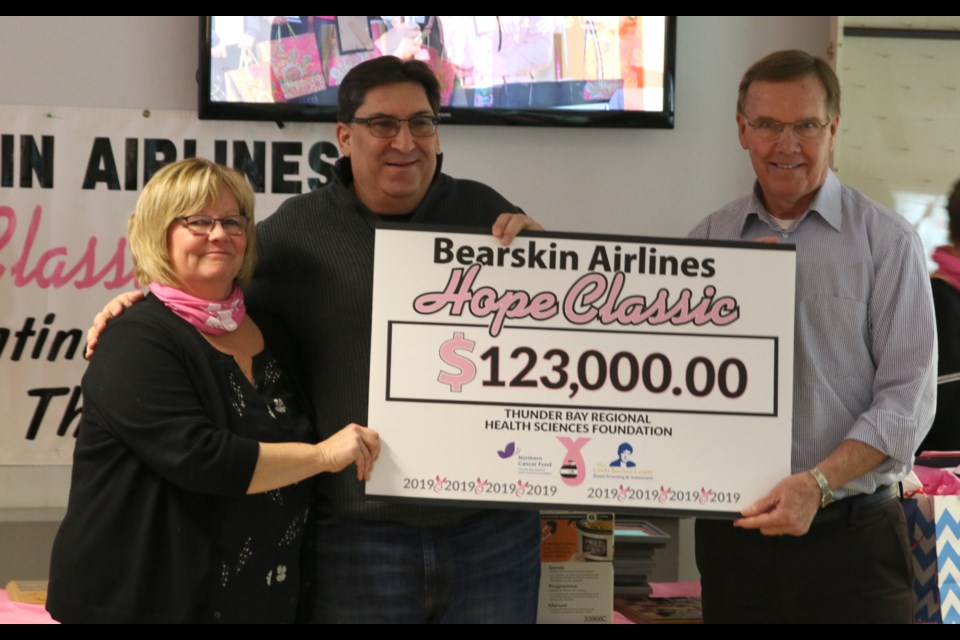 Susan Childs of the Bearskin Airlines Hope Classic (left), Ron Hell, director of marketing and Sales with Bearkskin Airlines (middle), and Brian McKinnon announce the total raised during the 23rd Annual Bearskin Airlines Hope Classic. (Photos by Doug Diaczuk - Tbnewswatch.com).  