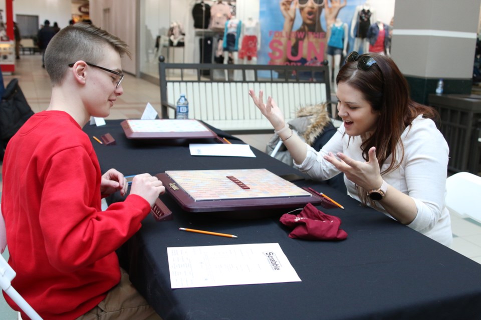 Scrabble is a game of emotions. Madison Schell (right) faces off against Roman Devost during the 21st Annual Scrabble Tournament in support of the Thunder Bay Literacy Group. (Photos by Doug Diaczuk - Tbnewswatch.com).  