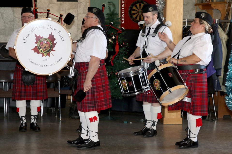 Members of the MacGillivray Pipe Band play during New Year's Day levee ceremonies at HMCS Griffon on Tuesday, Jan. 1, 2018. (Leith Dunick, tbnewswatch.com)
