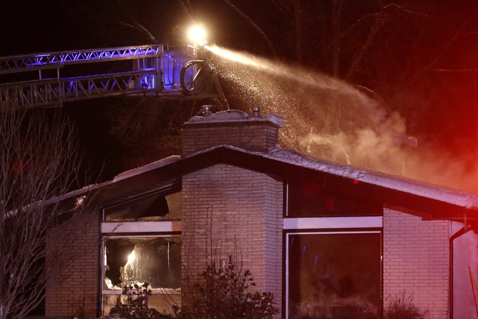 FIrefighters battle a a fire at a house on Parkway Drive on Wednesday, Jan. 23, 2019. (Leith Dunick, tbnewswatch.com)