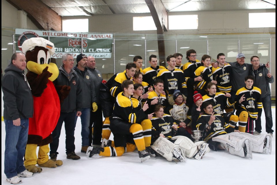 The Current River Comets celebrate their Midget AA title win over the Hearst Lumberkings on Sunday during the Robin's Minor Hockey Tournament. (Photos by Doug Diaczuk - Tbnewswatch.com). 