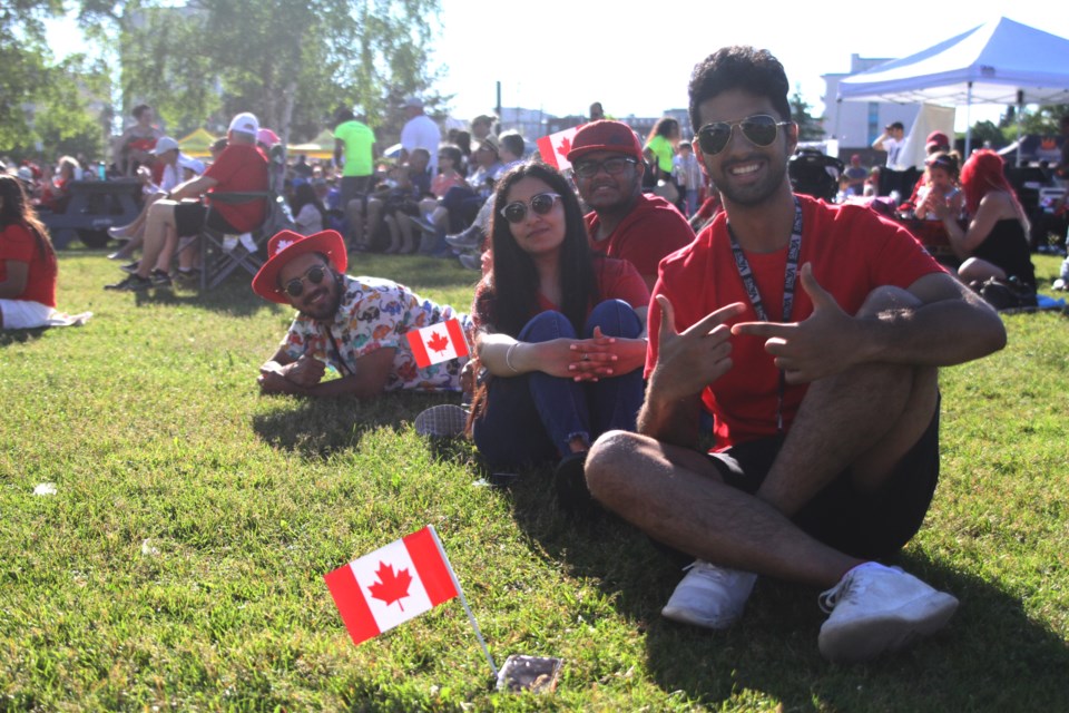 Saarthak Mahajan (close, right), Ritika Chadha, Shoaib Ahmed, Kartik Bhardwaj take in the Canada Day festivities at the Marina Park. (Michael Charlebois, tbnewswatch)
