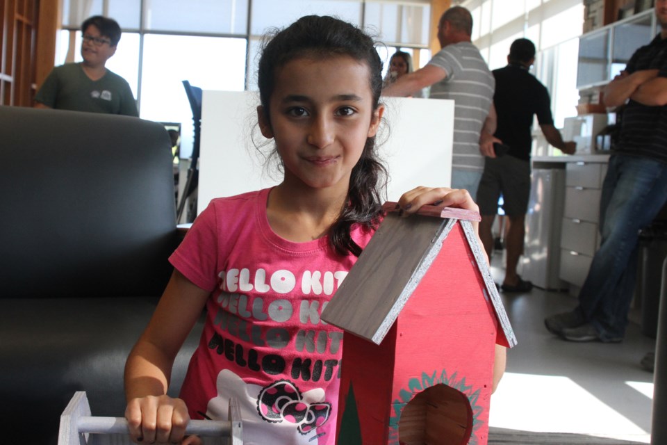 Eva Shekhibrahim and her birdhouse. (Michael Charlebois, tbnewswatch)