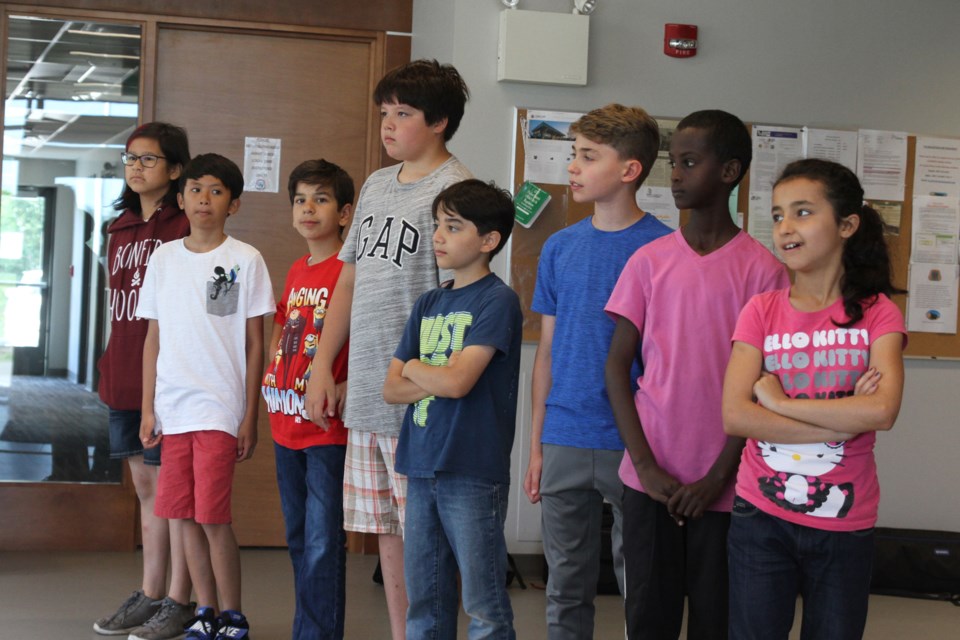 Students line up to received their camp certificates at Carpenters Local 1669 training centre. (Michael Charlebois, tbnewswatch)
