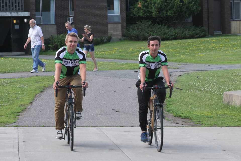 Brother Zac (left) and Nick Wagman are biking from Victoria B.C. to St. John’s, N.B. as part of the Green Jobs program. (Michael Charlebois, tbnewswatch)