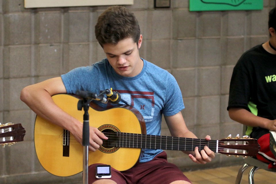 Napanee, Ont.'s Elliot Mundle, 15, performs House of the Rising Sun at a Shad Canada musical ensemble at Lakehead University on Wednesday, July 24, 2019. (Leith Dunick, tbnewswatch.com)