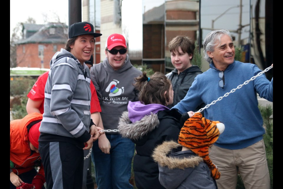 Thunder Bay Mayor, Bill Mauro, raises the Autism Ontario flag at City Hall with the help of students from Westmount Public School. (Photos by Doug Diaczuk - Tbnewswatch.com). 