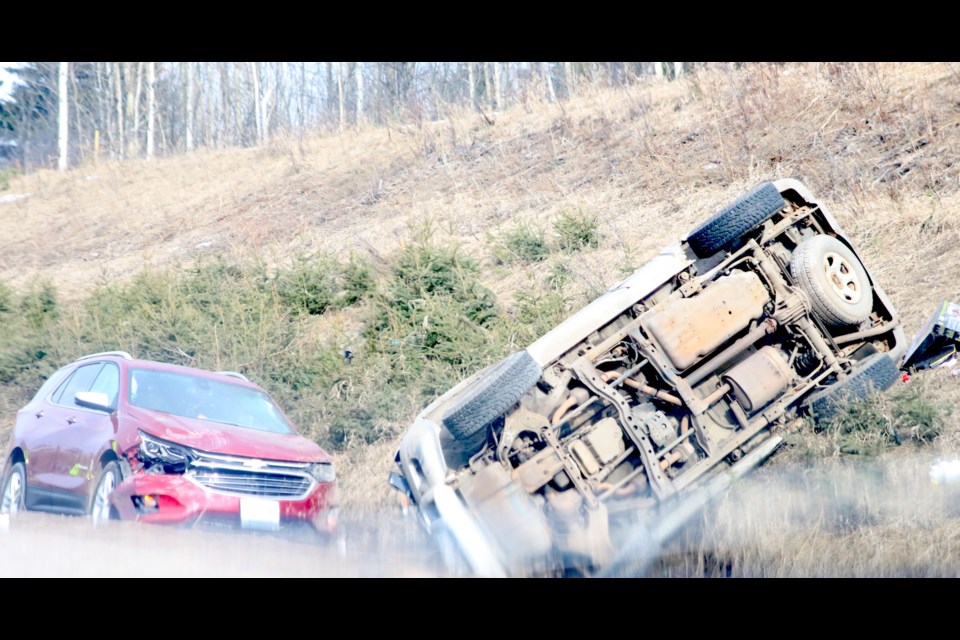 At least one person was sent to hospital and one person is in custody following a two-vehicle collision on Highway 61. 