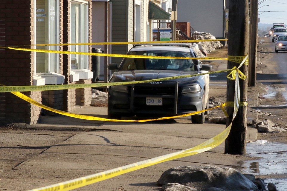 Police guard the scene of a homicide on North Cumberland Street on Thursday, March 21, 2019. (Leith Dunick, tbnewswatch.com)