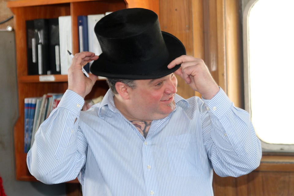 Capt. Scott Mogelin of MV Kaministiquia tries on the ceremonial top hat on Friday, March 29, 2019 at Richardson Terminal. His ship was the first to arrive in Thunder Bay to start the 2019-20 shipping season. 