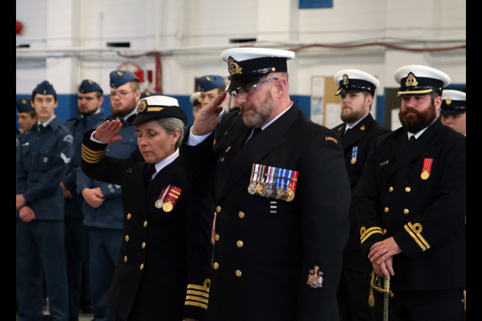Captain Jill Marrack and chief petty officer Doug Currie salute during a ceremony to commemorate the Battle of the Atlantic at HMCS Griffon on Sunday. (Photos by Doug Diaczuk - Tbnewswatch.com).  