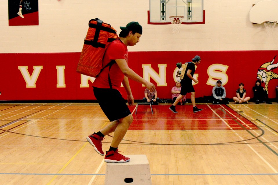 Kevin King Jr. carrying a hose as part of the WFX-Fit test (Michael Charlebois, tbnewswatch)