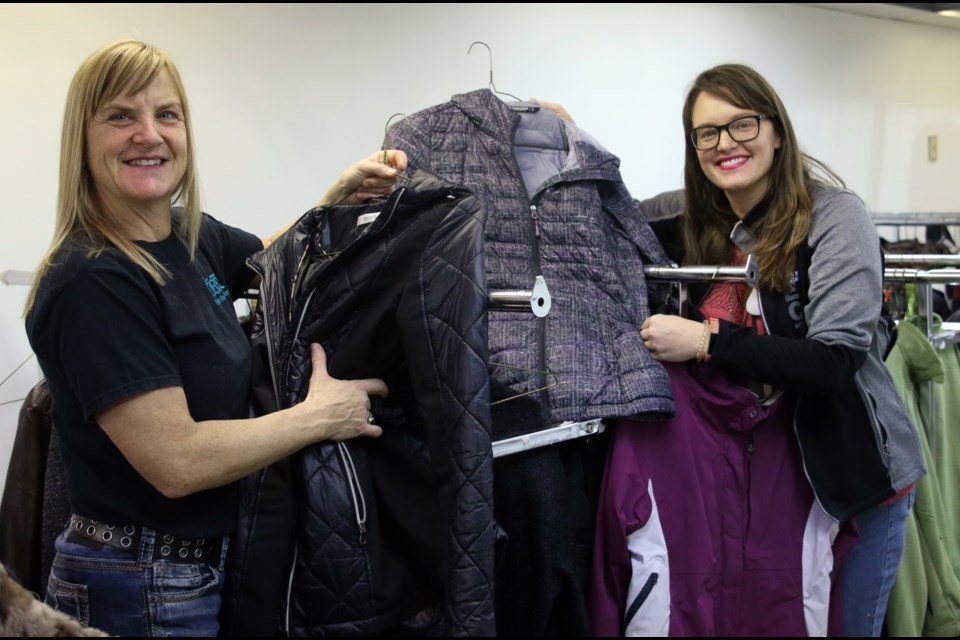 Catholic School Board teachers Solange Cote (left) and Sarah Polowski volunteer at the annual Coats for Kids clothing drive on Saturday. (Photos by Doug Diaczuk - Tbnewswatch.com). 
