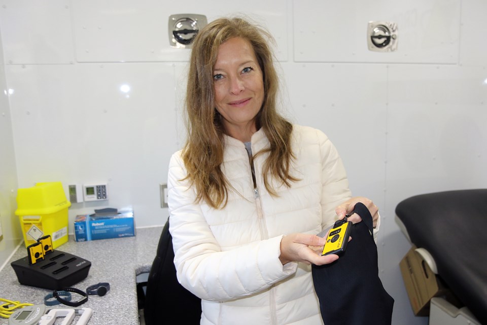 Lakehead University assistant professor Kathryn Sinden displays some of the tools she uses in the Centre for Research in Occupational Safety and Health mobile unit.  (Leith Dunick, tbnewswatch.com)