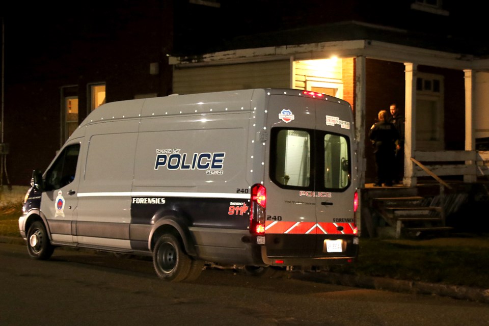 Thunder Bay Police Service's forensic team investigates an incident at a house at the corner of Dease and McKenzie streets on Tuesday, Oct. 8, 2019. (Leith Dunick, tbnewswatch.com)