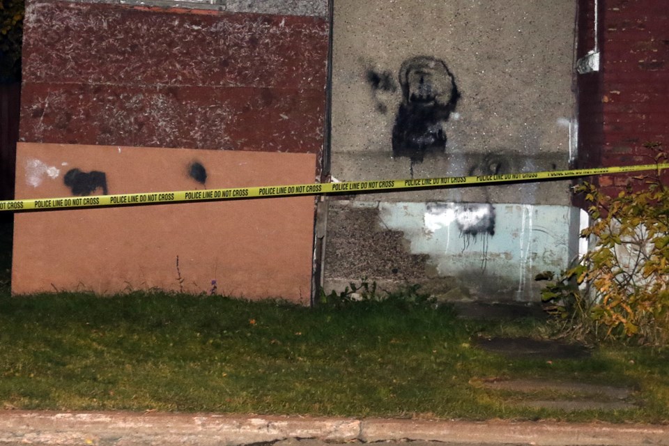 Police on Tuesday, Oct. 8, 2019 have taped off much of the outside of a home on the corner of Dease and McKenzie streets. (Leith Dunick, tbnewswatch.com)