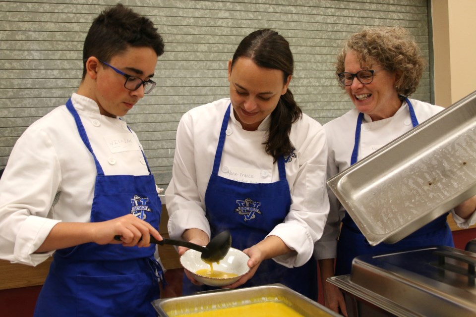 William Cerisano (left), Marie-France Tousignant, and Nathalie Bedard with École Secondaire Catholique De La Verendrye, prepared a carrot soup for the Empty Bowls, Caring Hearts fundraiser. (Photos by Doug Diaczuk - Tbnewswatch.com). 