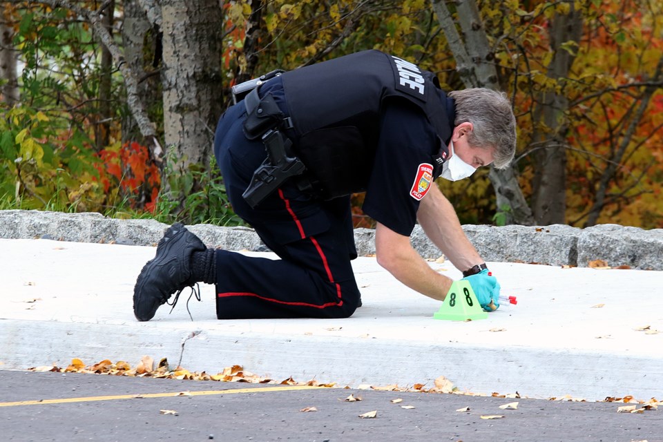 A Thunder Bay Police Service officer conducts an investigation on Thursday, Oct. 10, 2019 at Marina Park. (Leith Dunick, tbnewswatch.com)