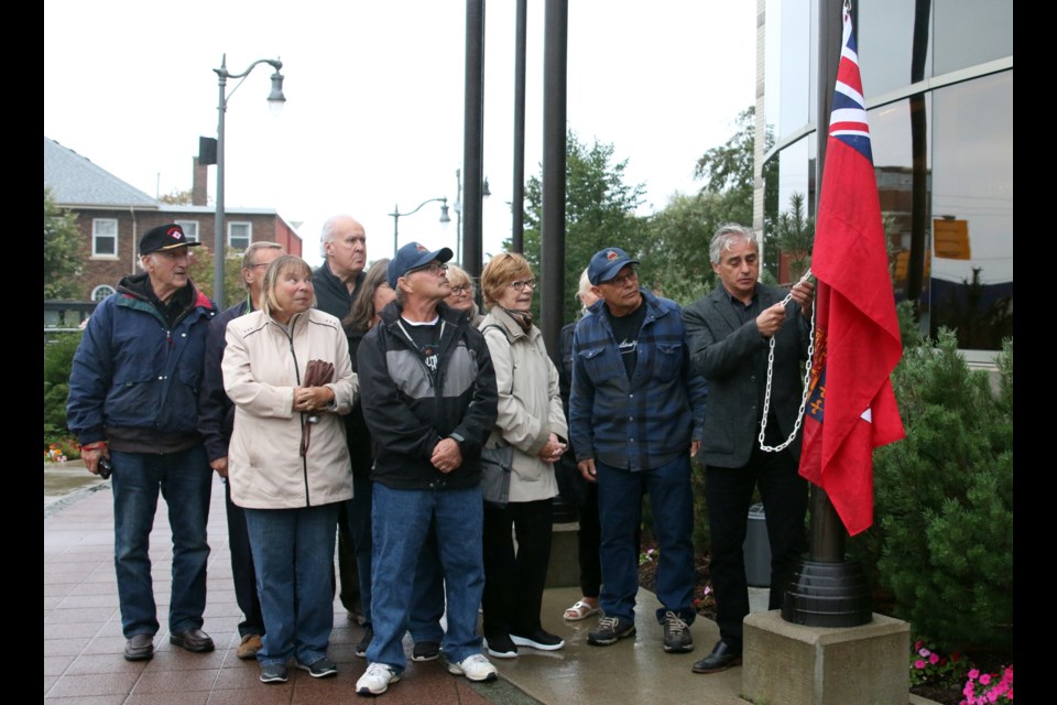 Family of veterans and Thunder Bay Mayor, Bill Mauro, raised the flag of the Canadian Merchant Navy to honour the sacrifices of merchant mariners during the Second World War. (Photos by Doug Diaczuk - Tbnewswatch.com). 