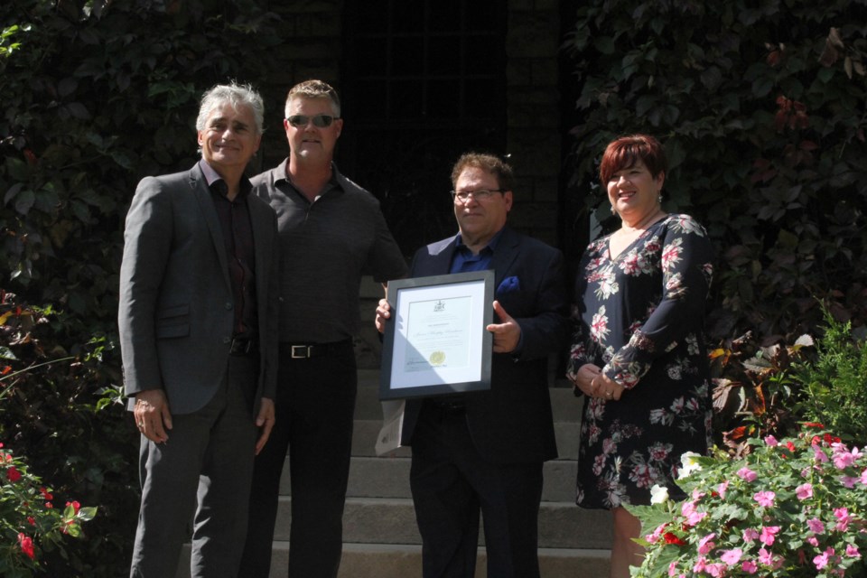Bill Mauro (left), Andrew Cotter, Bruno Valente, and Kristen Oliver acknowledging the James Murphy Mansion's 100th year. (Michael Charlebois, tbnewswatch)