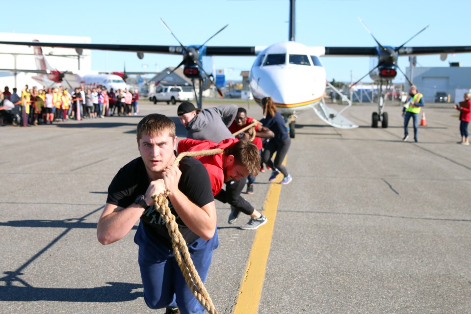 Bradley Grenier with a team from LU was one of 15 teams that took on the challenge of pulling a 26,000 pound Wasaya Airways Dash 8-300 aircraft during the 4th Annual Wasaya United Way Plane Pull. (Photos by Doug Diaczuk - Tbnewswatch.com). 