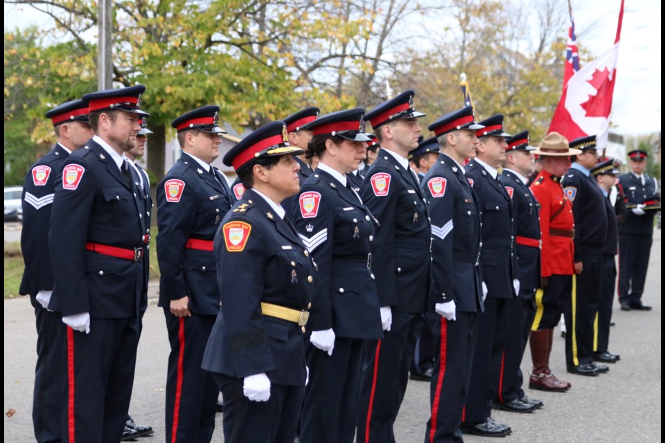 Members with various police services in the region stand at a attention before the The Police and Peace Officers' National Memorial Day Service. (Photos by Doug Diaczuk - Tbnewswatch.com). 