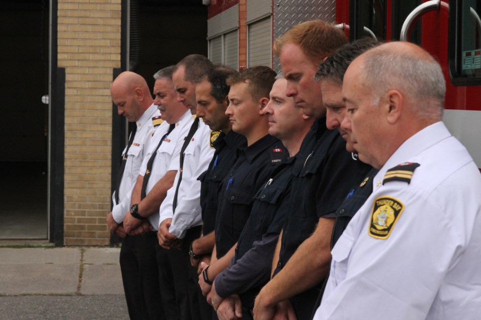 TBFR officials pay their respects to the fallen firefighters of the September 11 attacks. (Michael Charlebois, tbnewswatch)