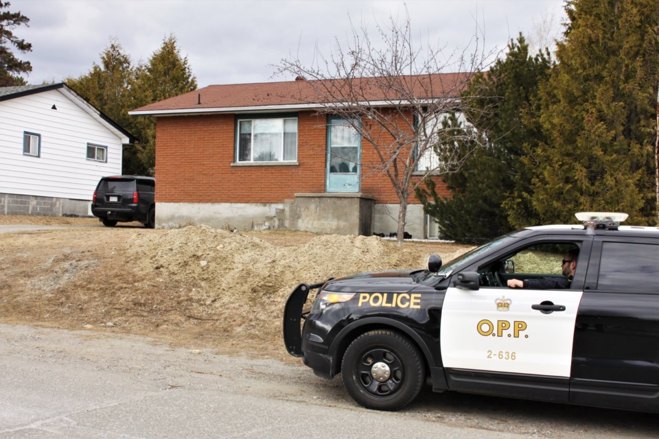 Police maintained a presence at a Duluth Street residence through much of the day Saturday. (Photos by Ian Kaufman, tbnewswatch.com)