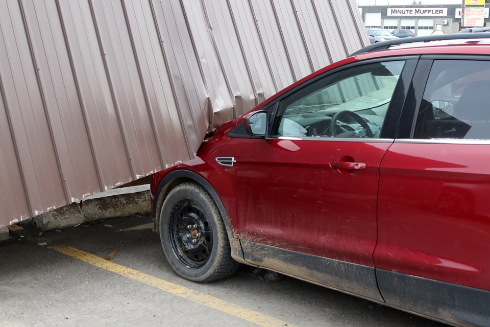A smoking shelter located on a hotel property on Memorial Avenue toppled over on Monday, April 13, 2020, in high winds. (Leith Dunick, tbnewswatch.com)