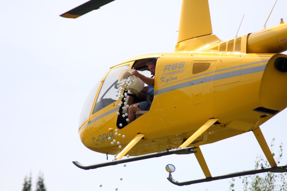 A helicopter dropped balls down onto the green during the Raising the Barr Golf Tournament in memory of local golfer, Dustin Barr. (Photos by Doug Diaczuk - Tbnewswatch.com). 