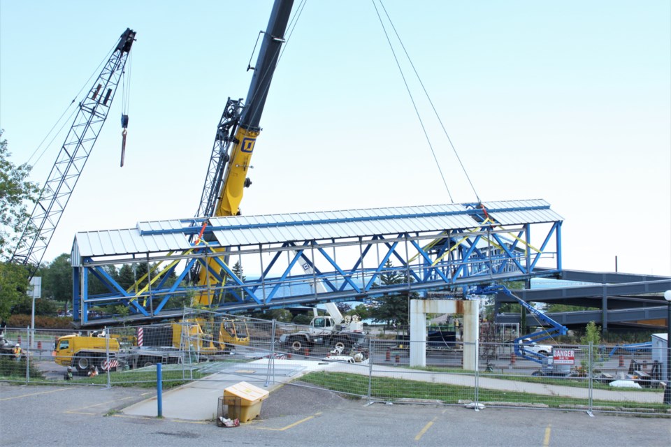 Workers with Tom Jones Corp. removed one of two sections of the Marina Park pedestrian overpass Thursday. (Photos by Ian Kaufman, tbnewswatch.com)