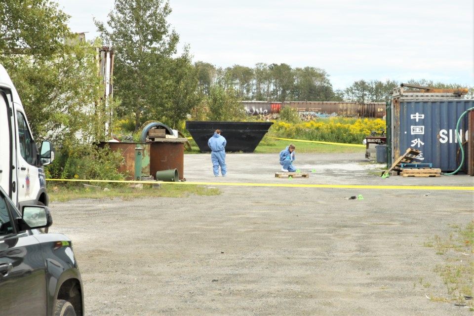 Thunder Bay police investigate a sudden death behind a Main Street building Sunday. (Ian Kaufman, tbnewswatch.com)
