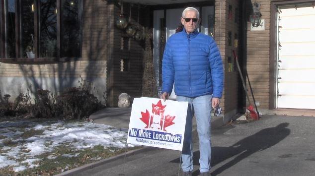 Paul Wiseman of Thunder Bay found an unwelcome sign planted in front of his home on Dec. 8, 2020 (Troy Charles/TBTV photo)