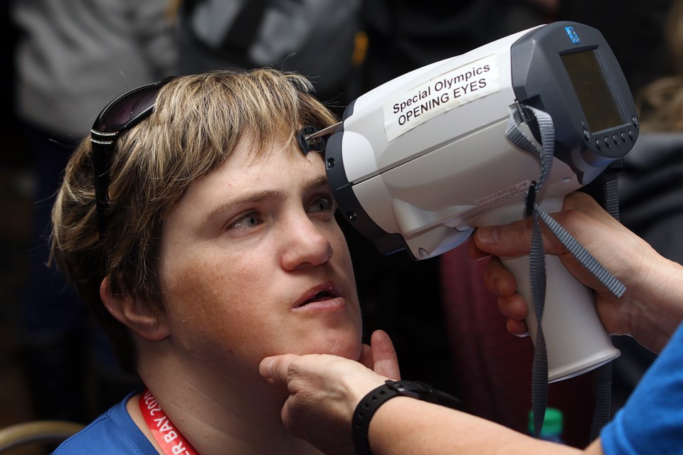 Manitoba's Jackie Trudeau on Monday, Feb. 24, 2020 has her eyes checked as part of Opening Eyes, which in turn is part of the Health Athletes Screenings being offered to 2020 Special Olympics Canada Winter Games participants in Thunder Bay. (Leith Dunick, tbnewswatch.com)